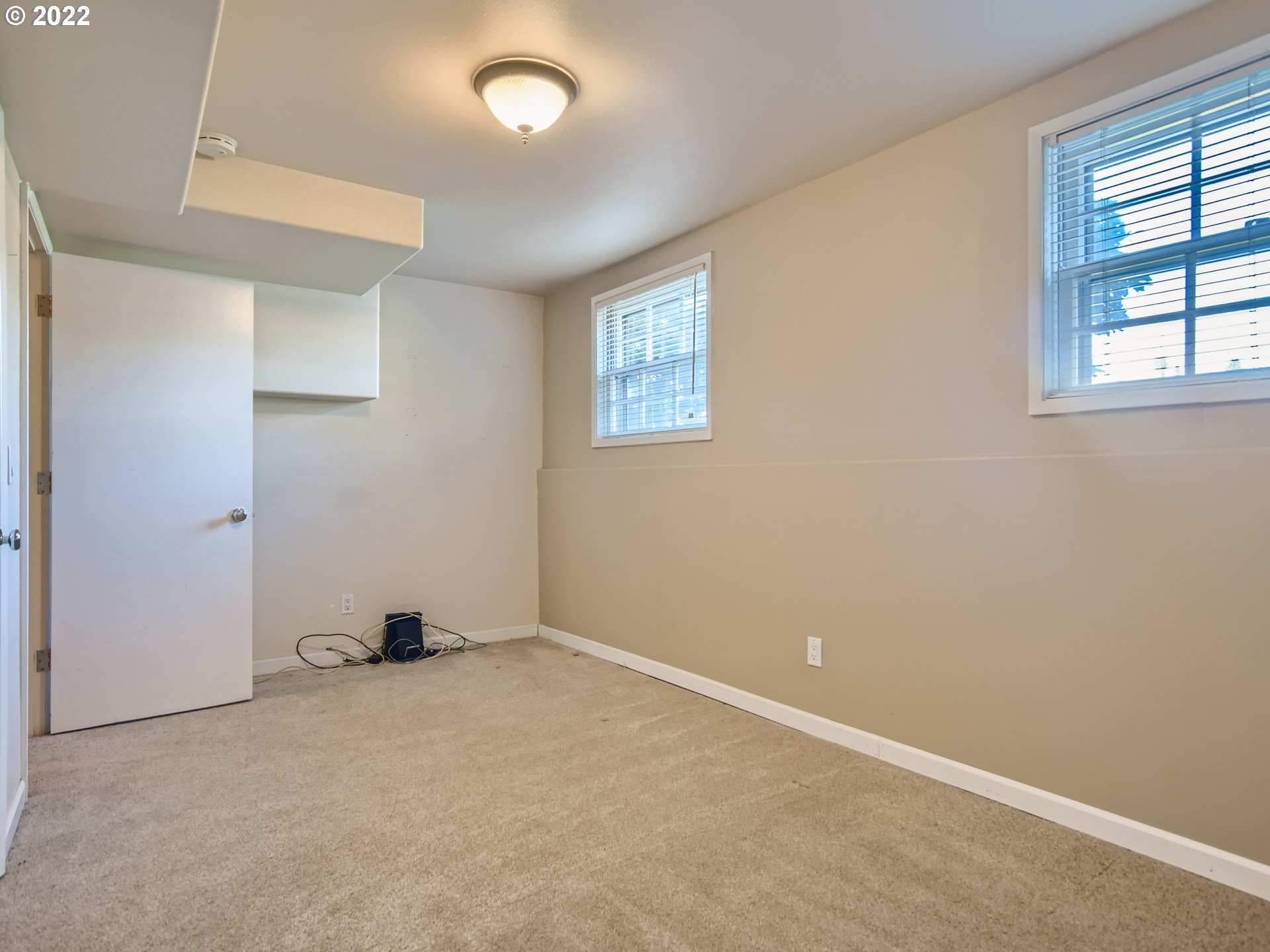 10920 Southeast Clay Street Portland, OR 97216 - Photo 22 of 30 an empty room with windows