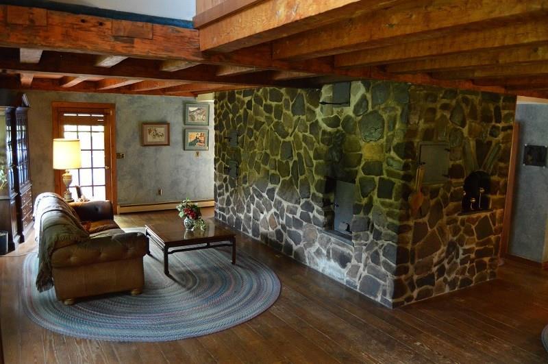 505 Stickney Hill Road Brownville, ME 04414 - Photo 10 of 30 Living Room with Russian Fireplace