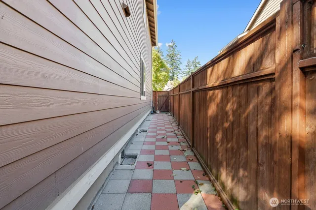 a balcony with wooden floor and fence