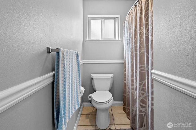 a bathroom with a toilet and a sink