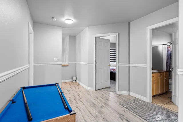 a view of hallway with wooden floor