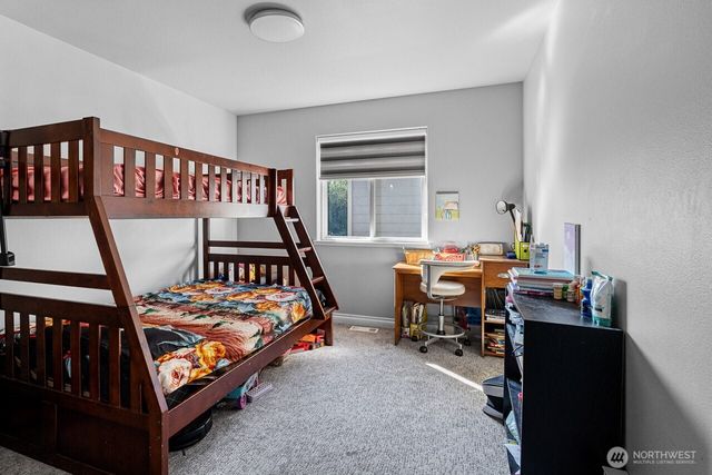 a bedroom with furniture and a window