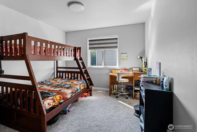 a bedroom with furniture and a window