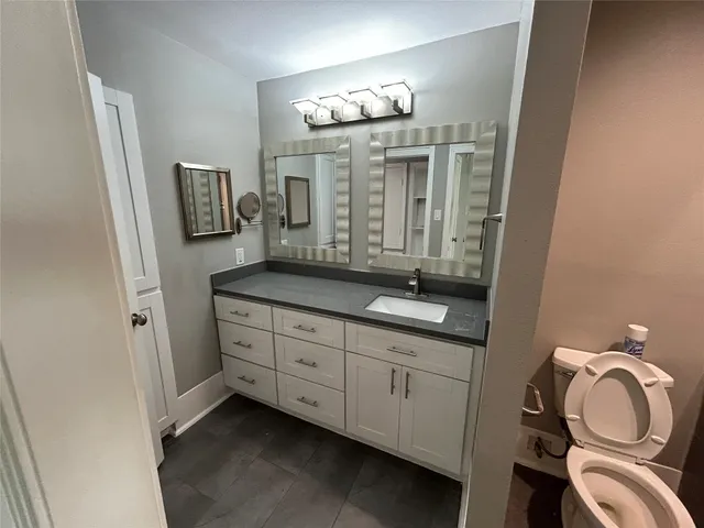 a view of parking garage with cars