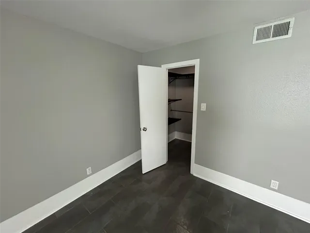 a view of an empty walk in closet