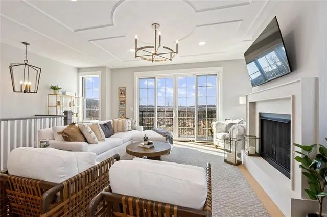a living room with furniture flower pot and a fireplace