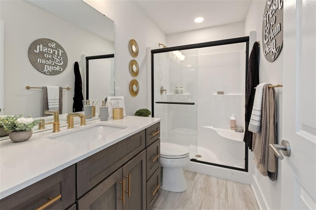 3001 Greeneview Lane Mars, PA 16046 - Photo 22 of 28 a bathroom with a sink a toilet and a large mirror