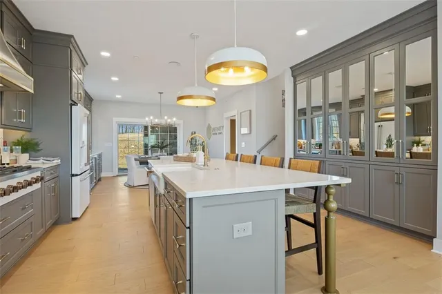a kitchen with a sink a counter top space and stainless steel appliances