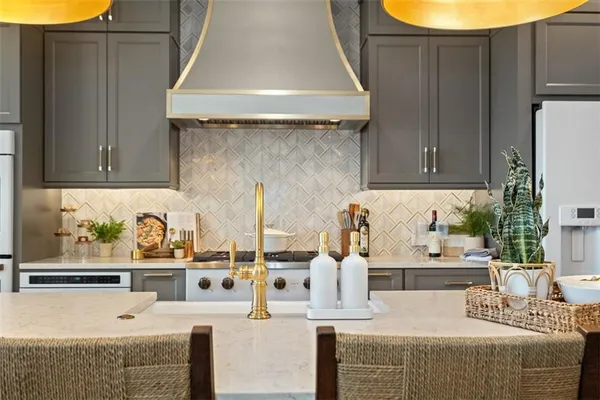 a kitchen with stainless steel appliances granite countertop a sink and cabinets