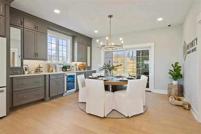 a view of kitchen with kitchen island stainless steel appliances living room and living room