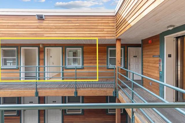 a room with furniture and a flat screen tv