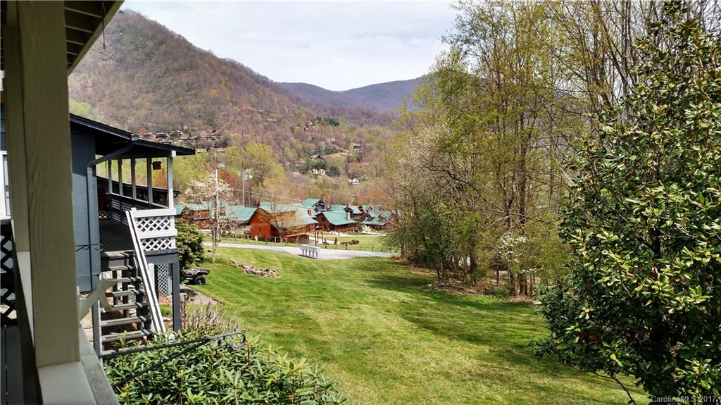 444 Stoney Ridge Loop, Unit 50 Maggie Valley, NC 28751 - Photo 17 of 19 a view of yard with swimming pool and seating area
