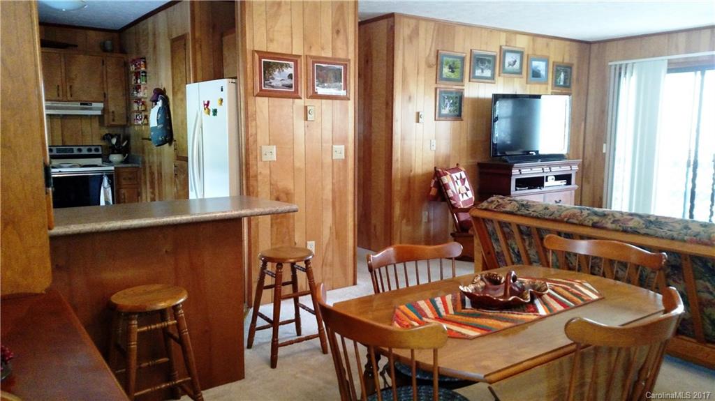 444 Stoney Ridge Loop, Unit 50 Maggie Valley, NC 28751 - Photo 3 of 19 a dining room with furniture and window