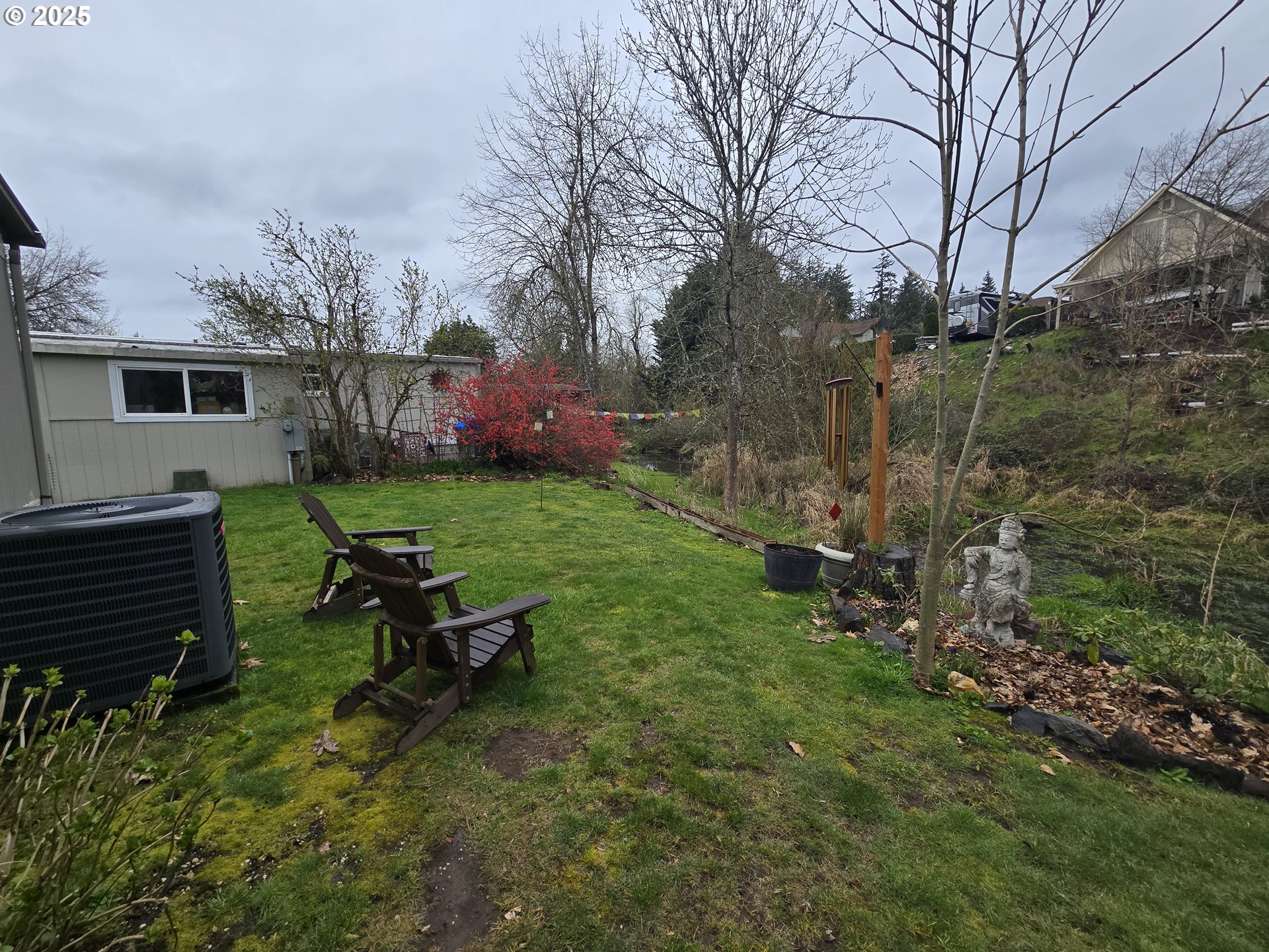 1475 Green Acres Road Eugene, OR 97408 - Photo 15 of 17 a view of a backyard with sitting area