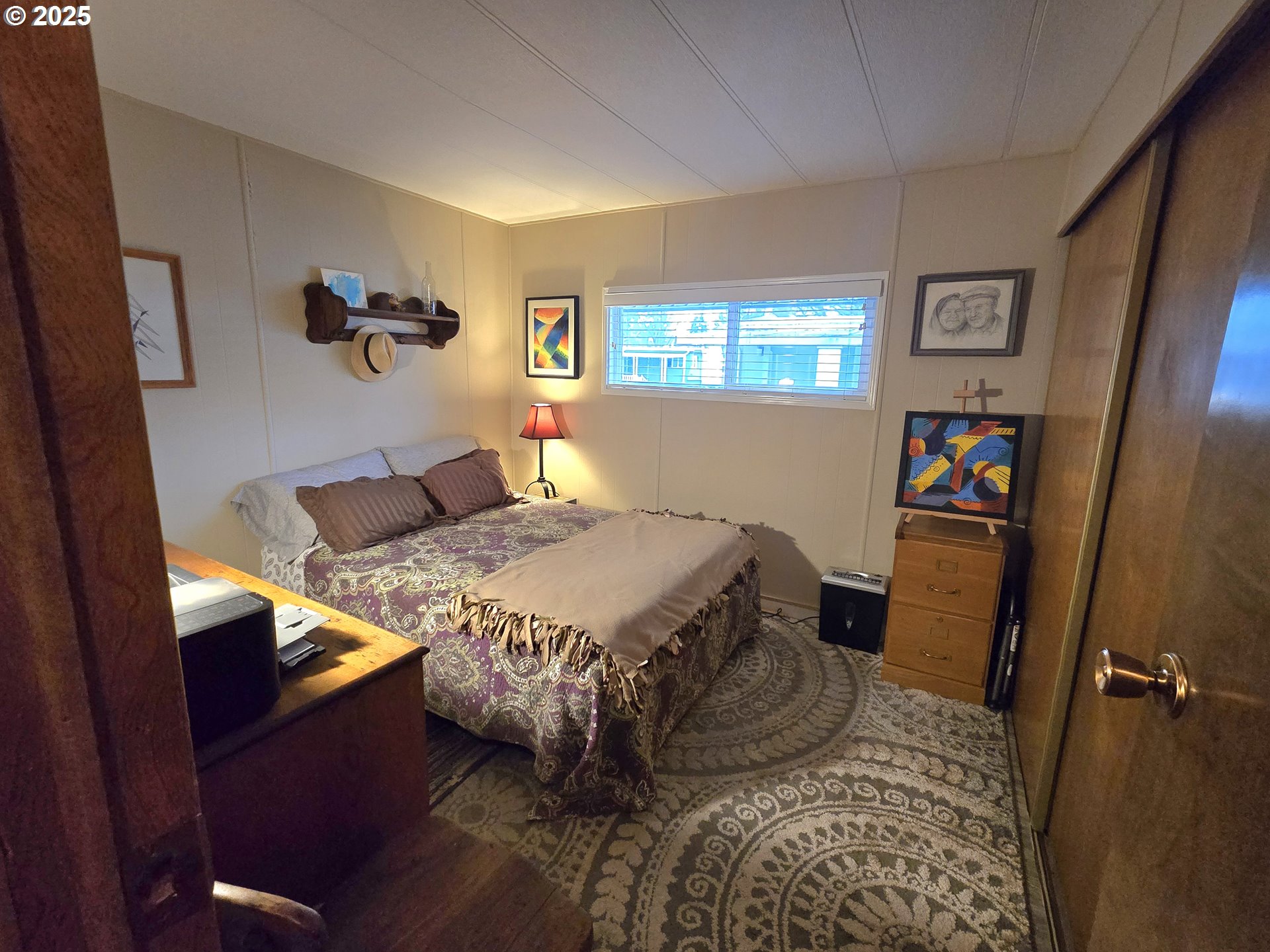 1475 Green Acres Road Eugene, OR 97408 - Photo 3 of 17 a bedroom with a bed and wooden floor