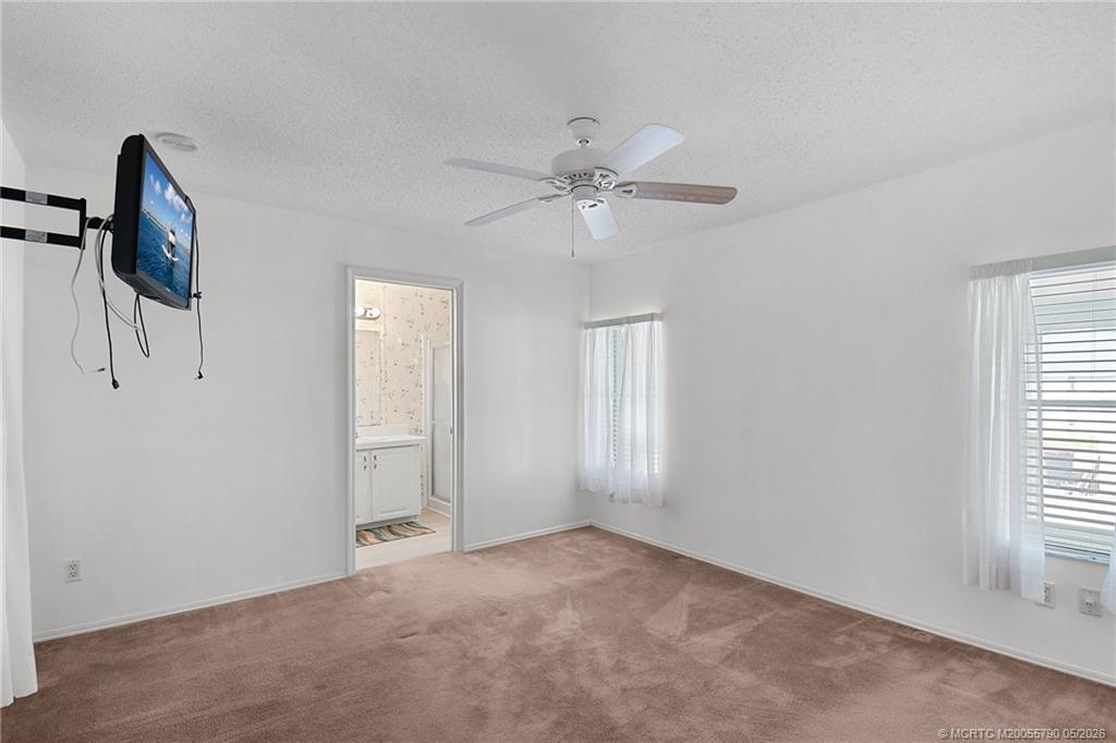 7149 Southeast Ridgeway Terrace Hobe Sound, FL 33455 - Photo 23 of 34 Primary bedroom is ensuite