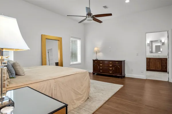 a bedroom with a bed and a fireplace