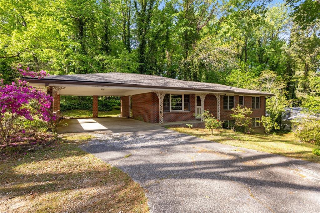 470 Hunnicutt Road Southeast Mableton, GA 30126 - Photo 1 of 1 a view of a house with a yard and sitting area
