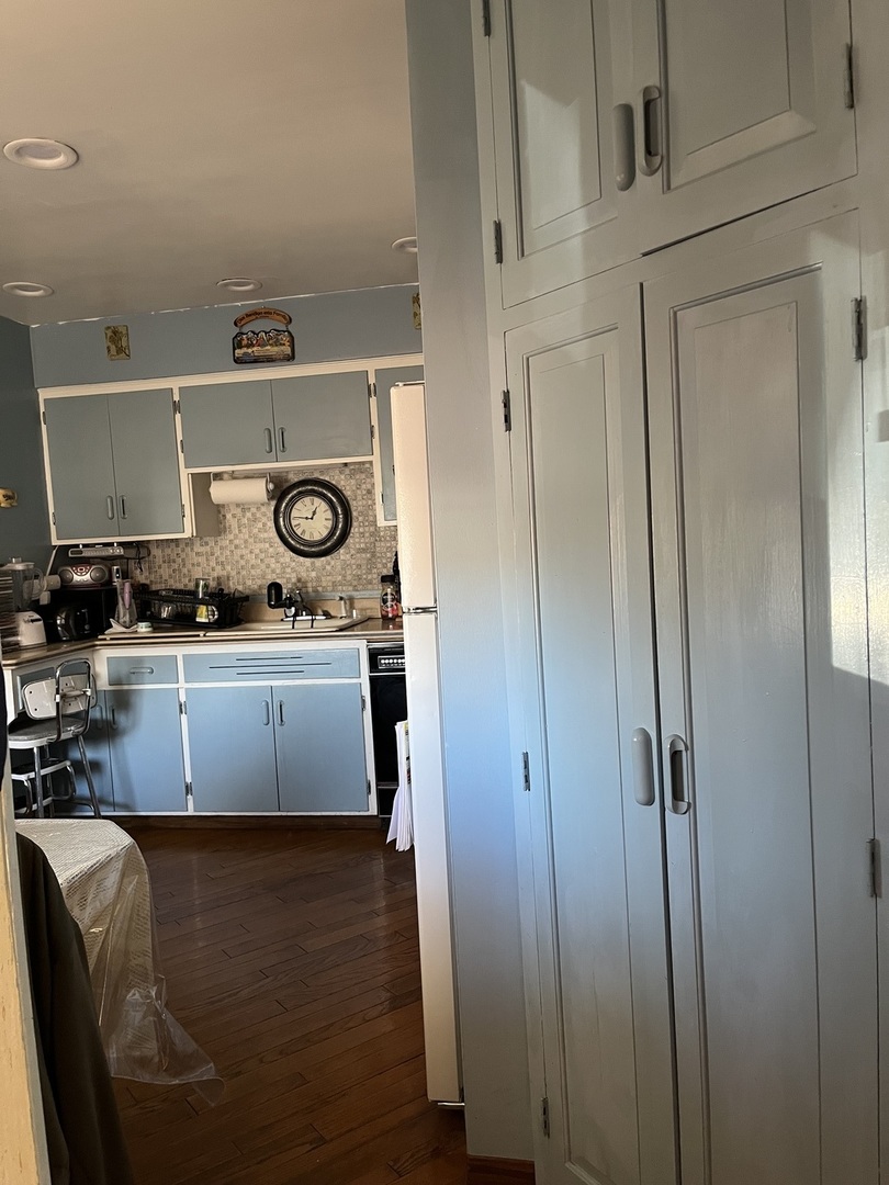 2522 South 3rd Avenue North Riverside, IL 60546 - Photo 11 of 34 a kitchen with stainless steel appliances granite countertop a stove and a refrigerator