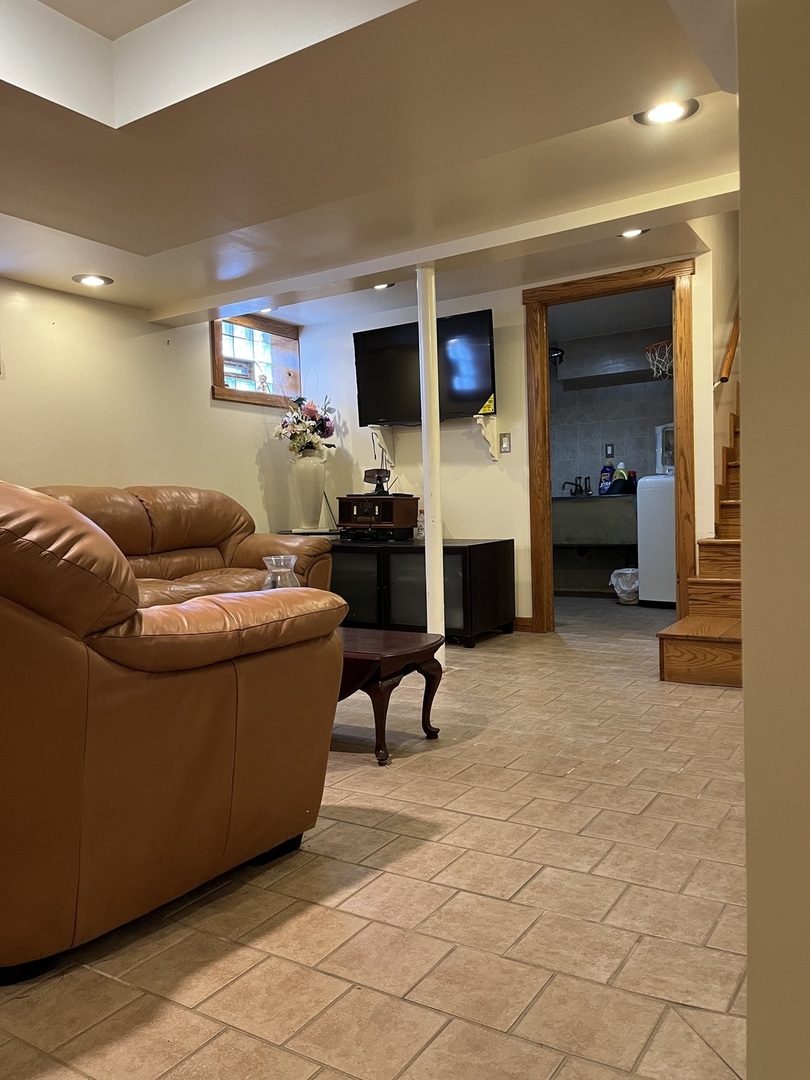 2522 South 3rd Avenue North Riverside, IL 60546 - Photo 17 of 34 a living room with furniture and a flat screen tv