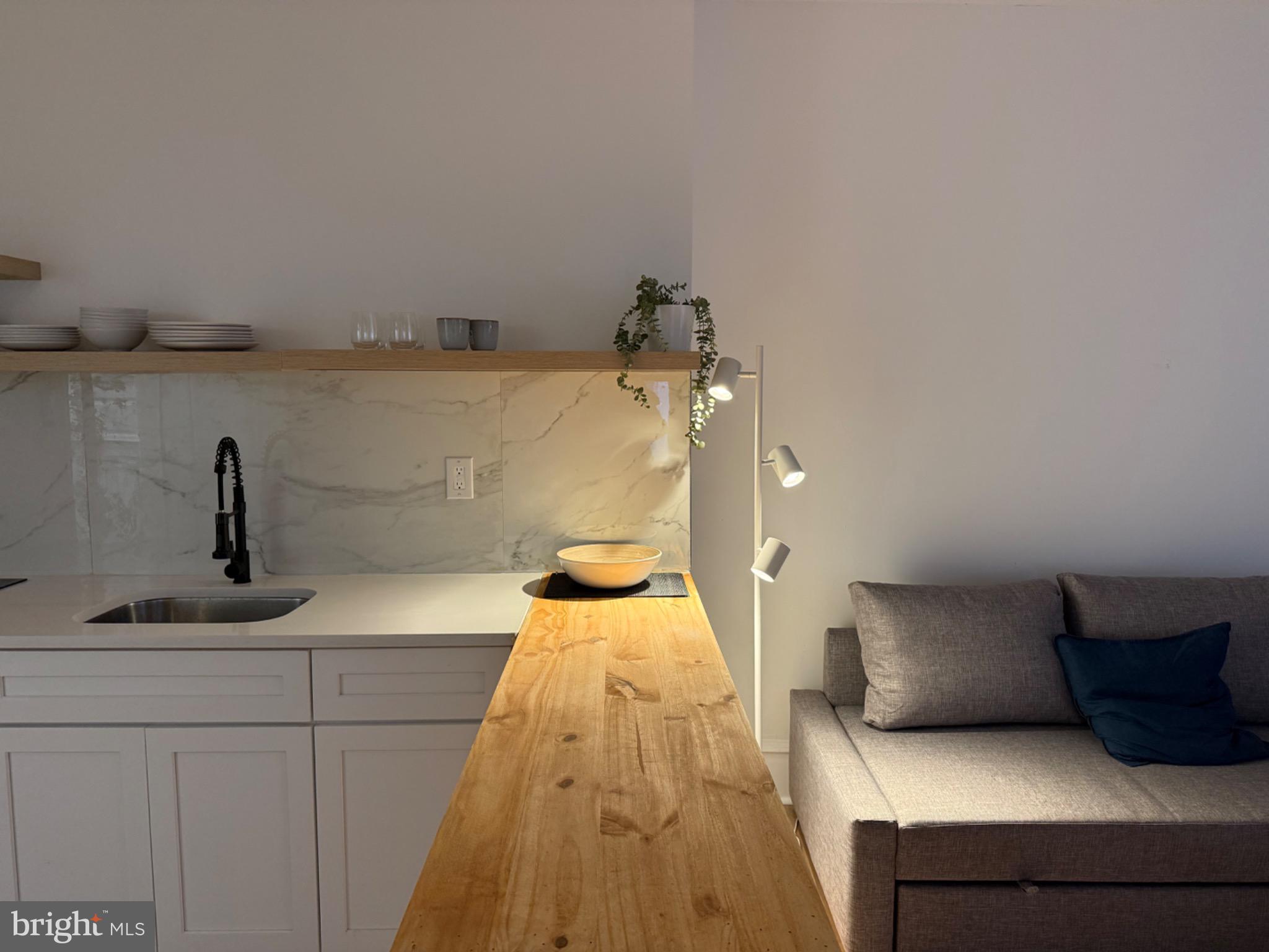 114 South 58th Street, Unit 1 Philadelphia, PA 19139 - Photo 3 of 15 a living room with furniture