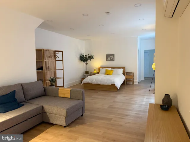 a bedroom with furniture and a couch