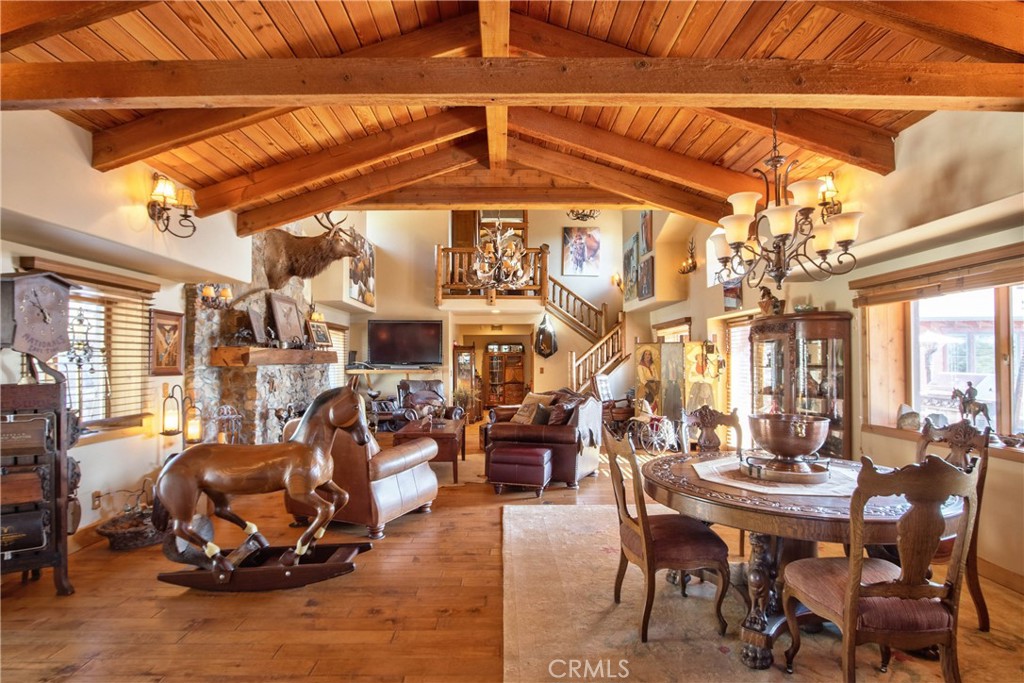 58111 Bonita Vista Road Mountain Center, CA 92561 - Photo 12 of 75 a view of a dining room with furniture and chandelier