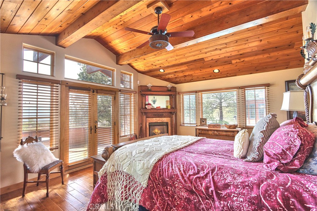 58111 Bonita Vista Road Mountain Center, CA 92561 - Photo 26 of 75 a spacious bedroom with a large bed and a large window