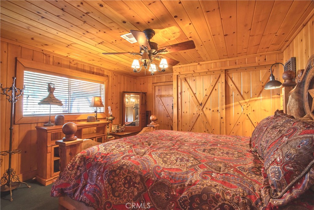 58111 Bonita Vista Road Mountain Center, CA 92561 - Photo 54 of 75 a bed sitting in a bedroom next to a window