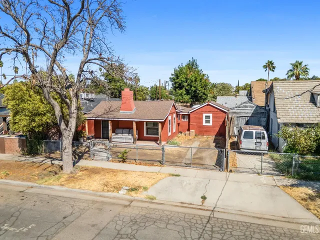 a view of a house with snow on the road
