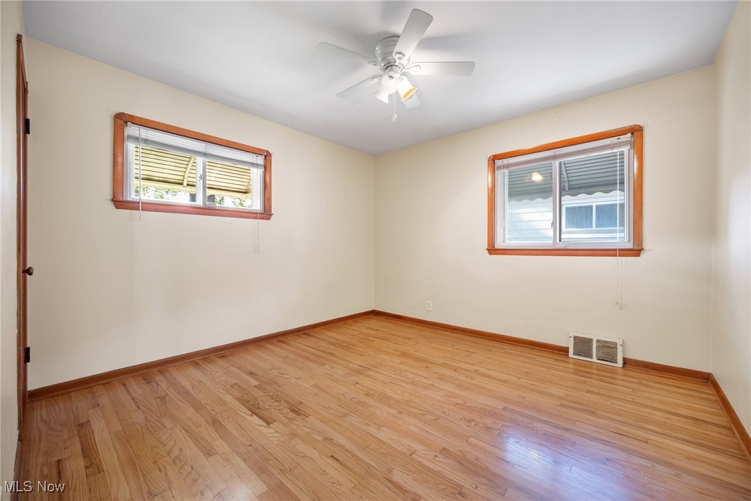 16913 Martha Road Cleveland, OH 44135 - Photo 15 of 26 Spare room featuring light hardwood / wood-style floors and ceiling fan