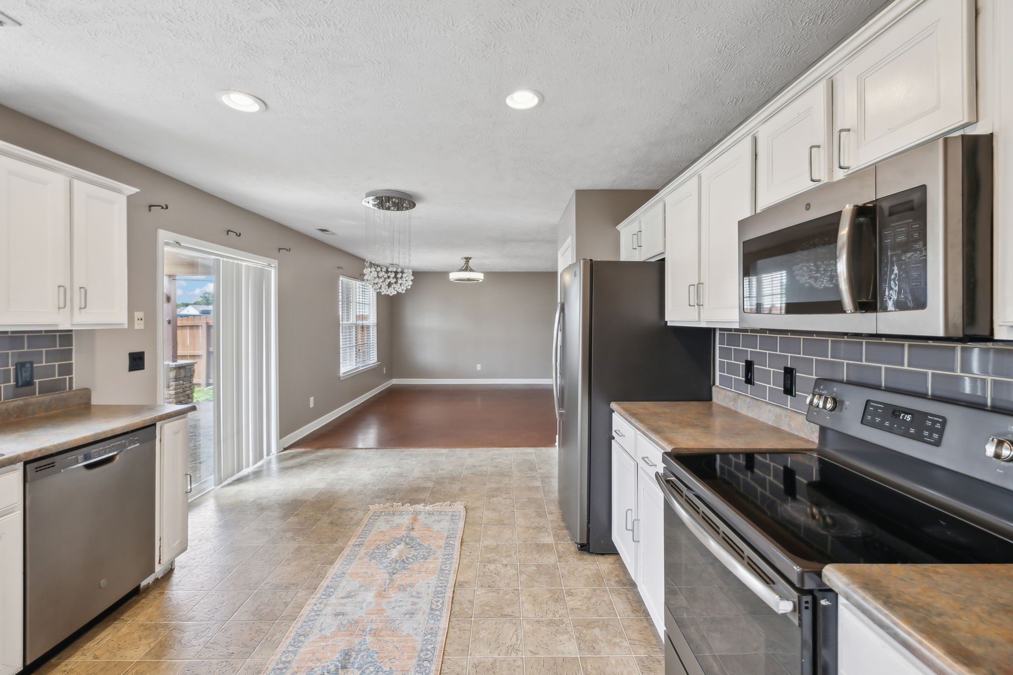 325 Golfview Lane Springfield, TN 37172 - Photo 16 of 51 a large kitchen with stainless steel appliances granite countertop a sink and a stove