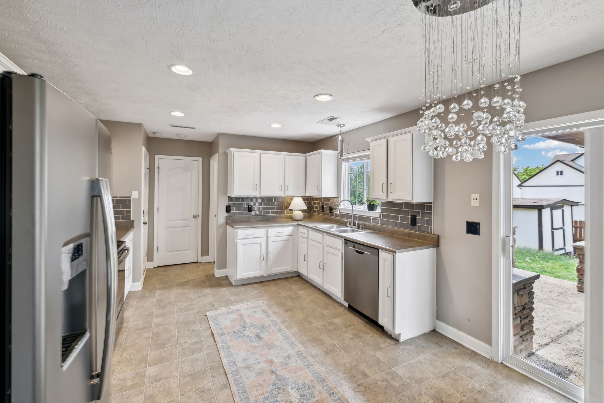 325 Golfview Lane Springfield, TN 37172 - Photo 18 of 51 a kitchen with a refrigerator and a sink