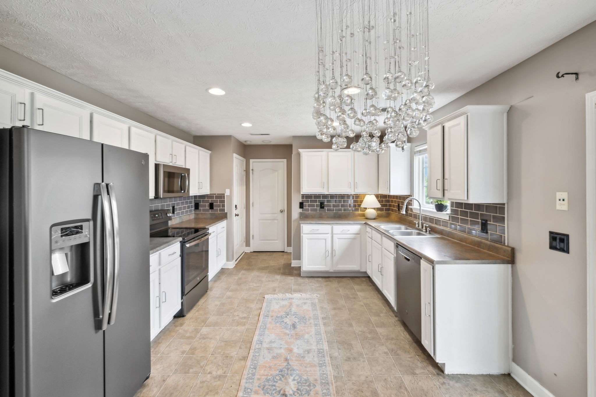 325 Golfview Lane Springfield, TN 37172 - Photo 19 of 51 a large kitchen with kitchen island a sink stainless steel appliances and cabinets