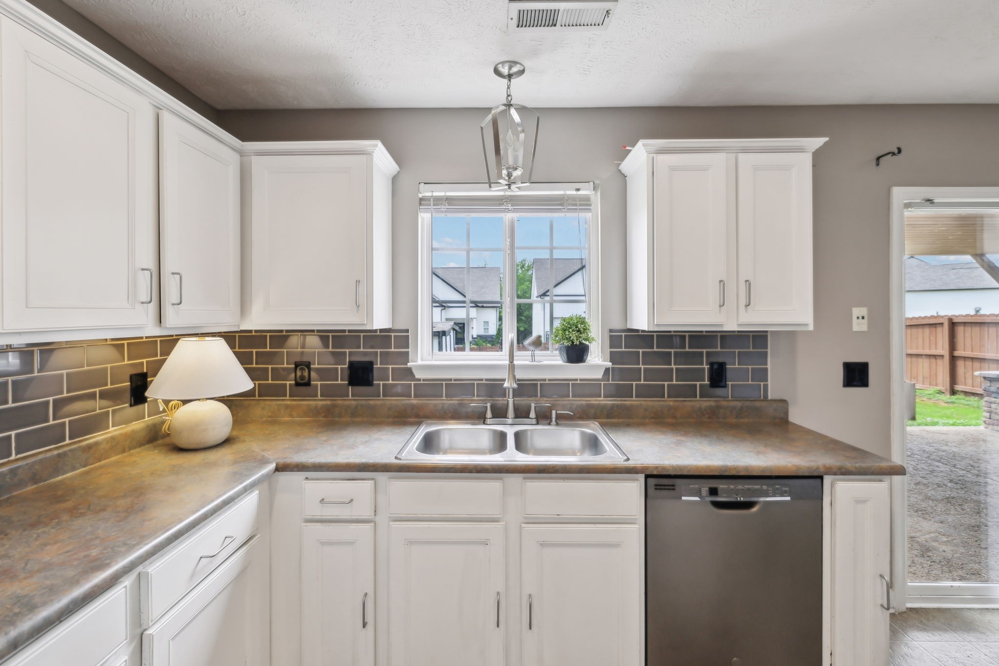 325 Golfview Lane Springfield, TN 37172 - Photo 22 of 51 a kitchen with a sink cabinets and window