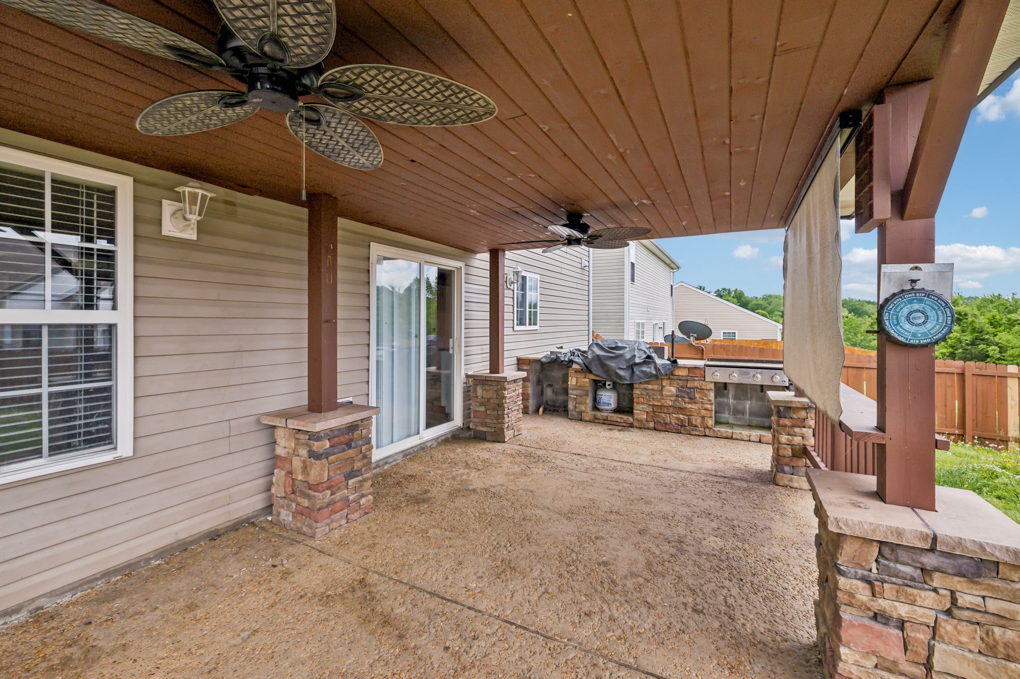 325 Golfview Lane Springfield, TN 37172 - Photo 43 of 51 a view of a patio with table and chairs and a barbeque