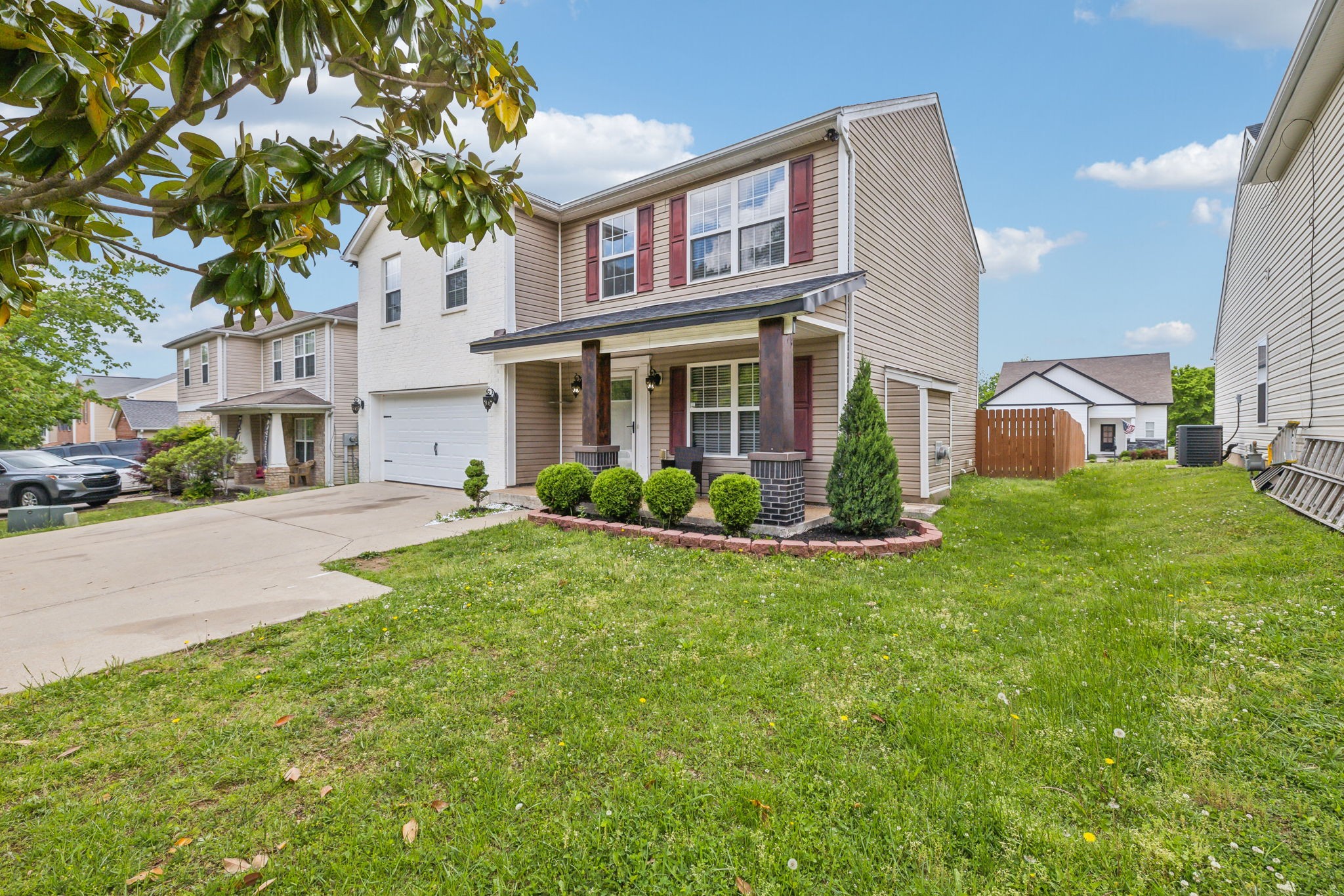 325 Golfview Lane Springfield, TN 37172 - Photo 5 of 51 a view of a white house with a big yard plants and large trees