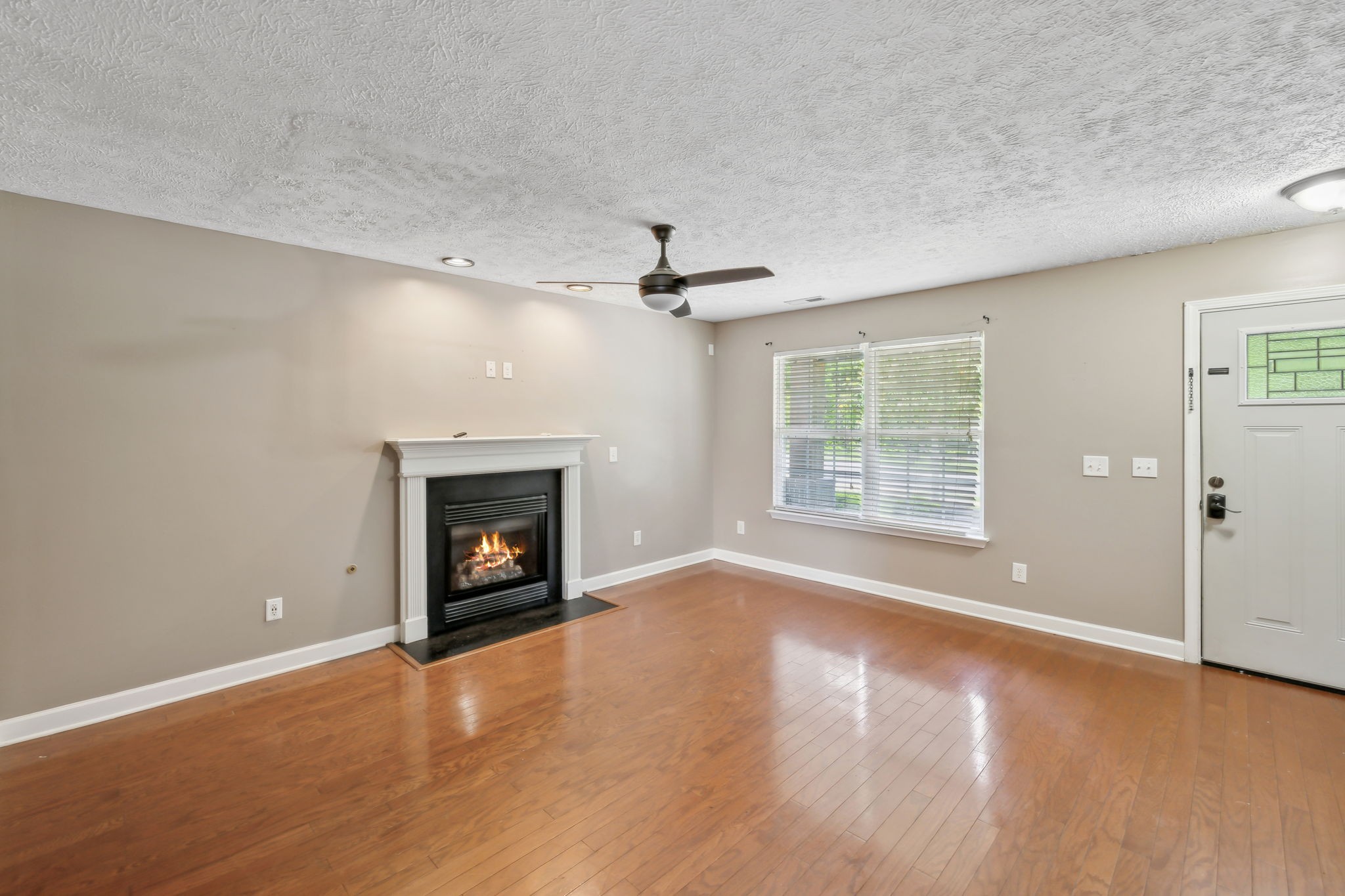 325 Golfview Lane Springfield, TN 37172 - Photo 10 of 51 an empty room with windows and fireplace