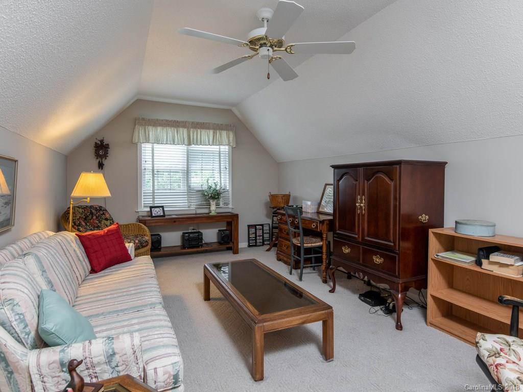 232 Stonehollow Road Fletcher, NC 28732 - Photo 24 of 35 a living room with furniture and a window