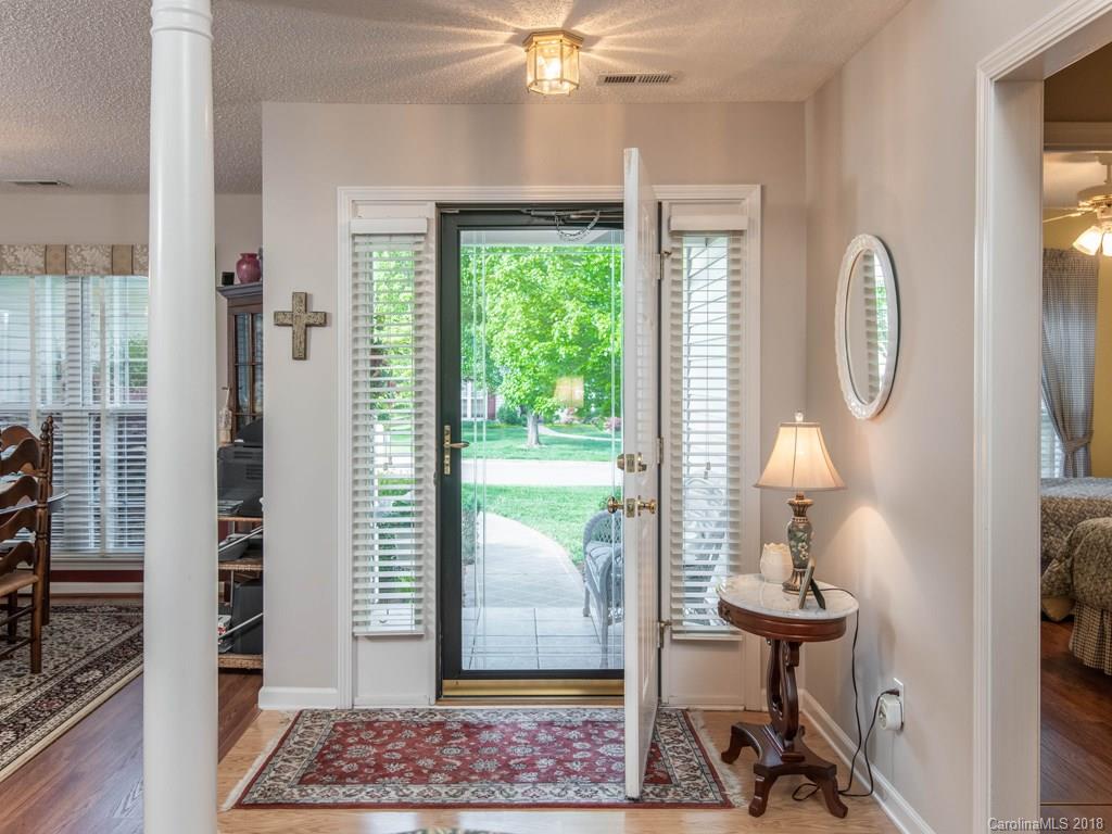 232 Stonehollow Road Fletcher, NC 28732 - Photo 4 of 35 a view of hall way with mirror and a window