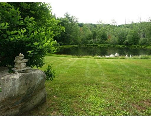 13 Scott Road Harvard, MA 01451 - Photo 26 of 29 a view of a garden with a lake