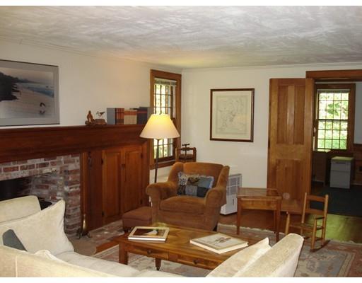 13 Scott Road Harvard, MA 01451 - Photo 8 of 29 a living room with furniture and a fireplace