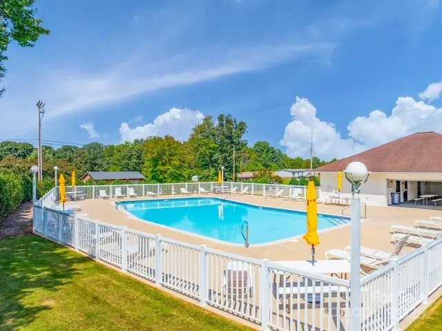 a view of a house with a backyard