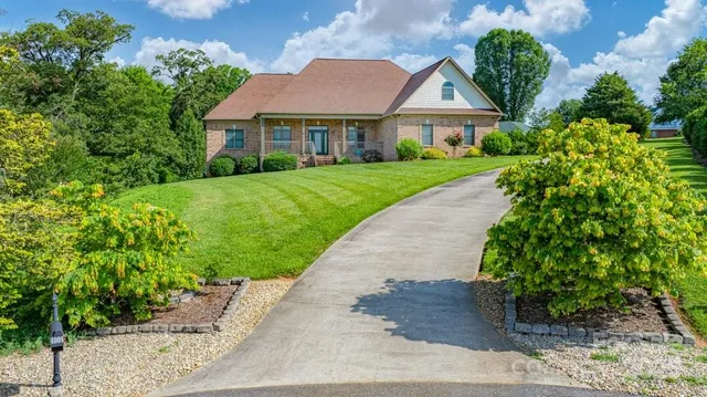 front view of a house next to a yard