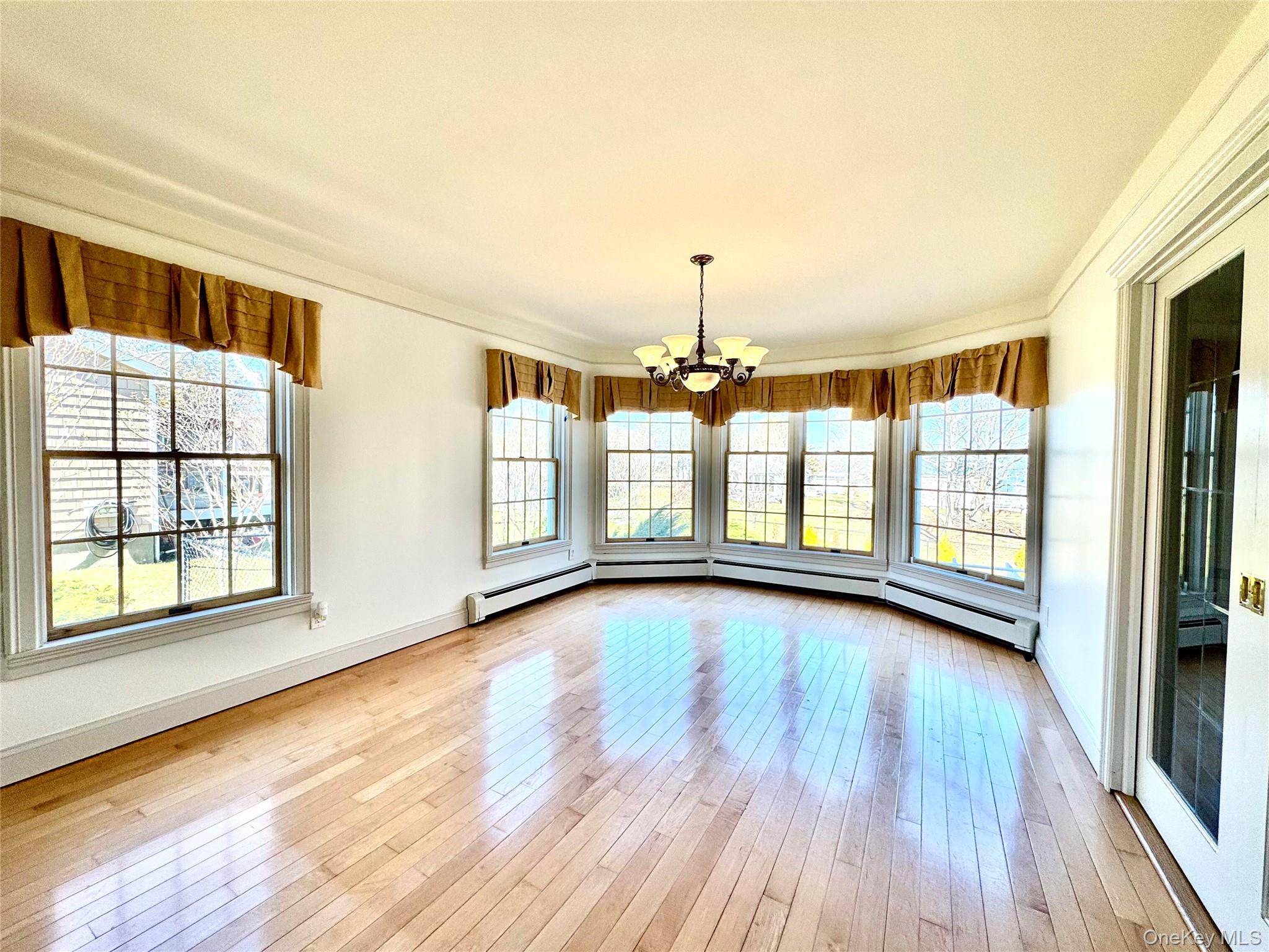 886 Sound Shore Road Riverhead, NY 11901 - Photo 15 of 39 Dining room with pocket French doors to kitchen.