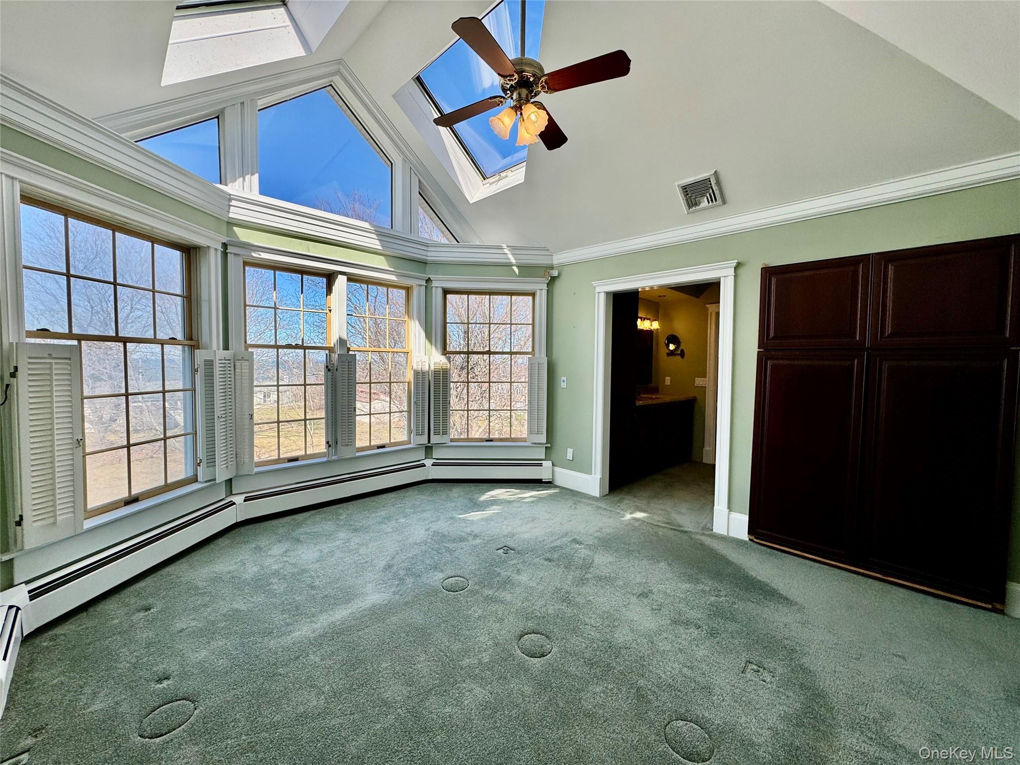 886 Sound Shore Road Riverhead, NY 11901 - Photo 24 of 39 Primary bedroom with cathedral ceilings and stunning view of the sound