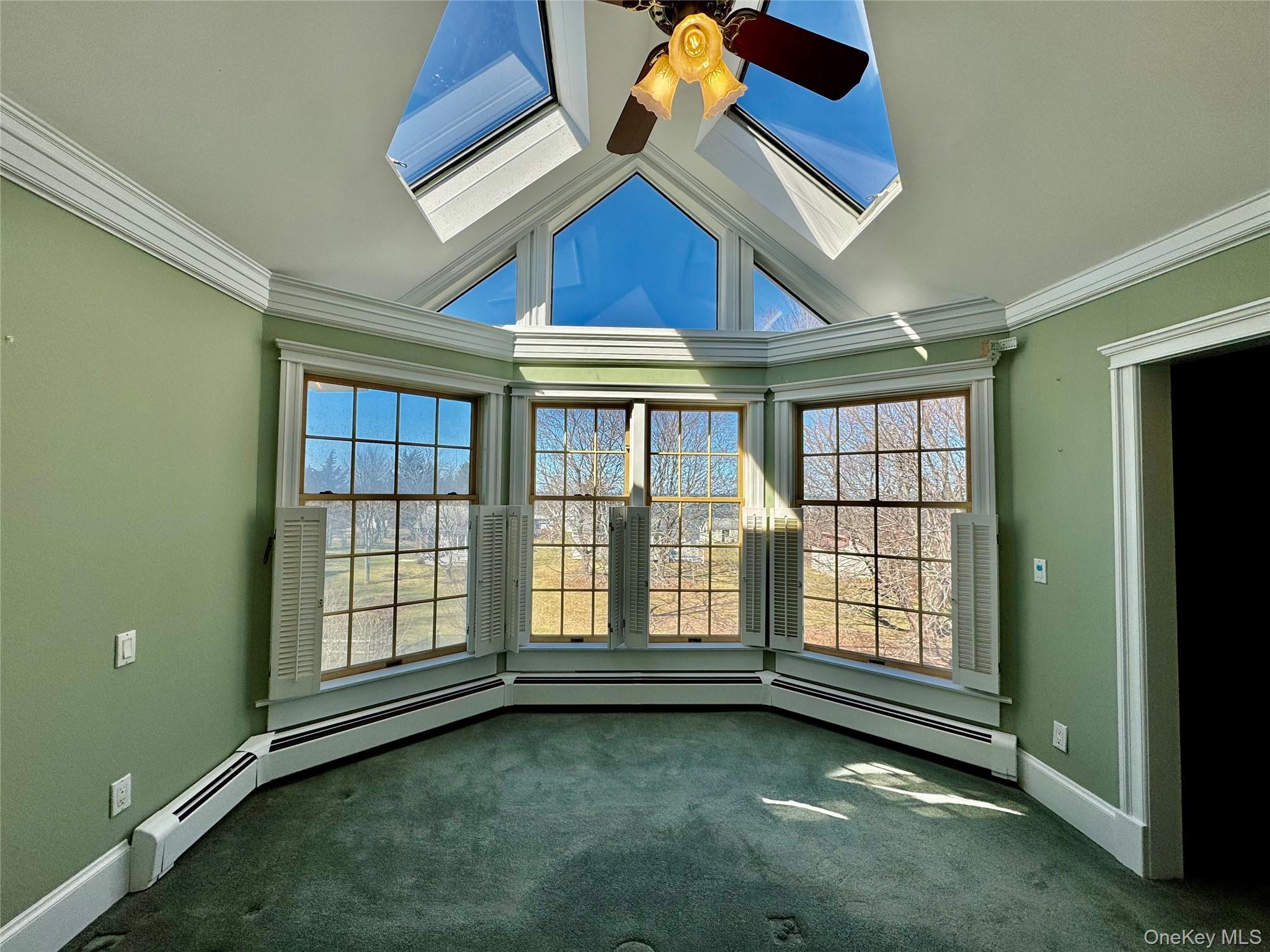 886 Sound Shore Road Riverhead, NY 11901 - Photo 25 of 39 Primary bedroom with large windows and skylights