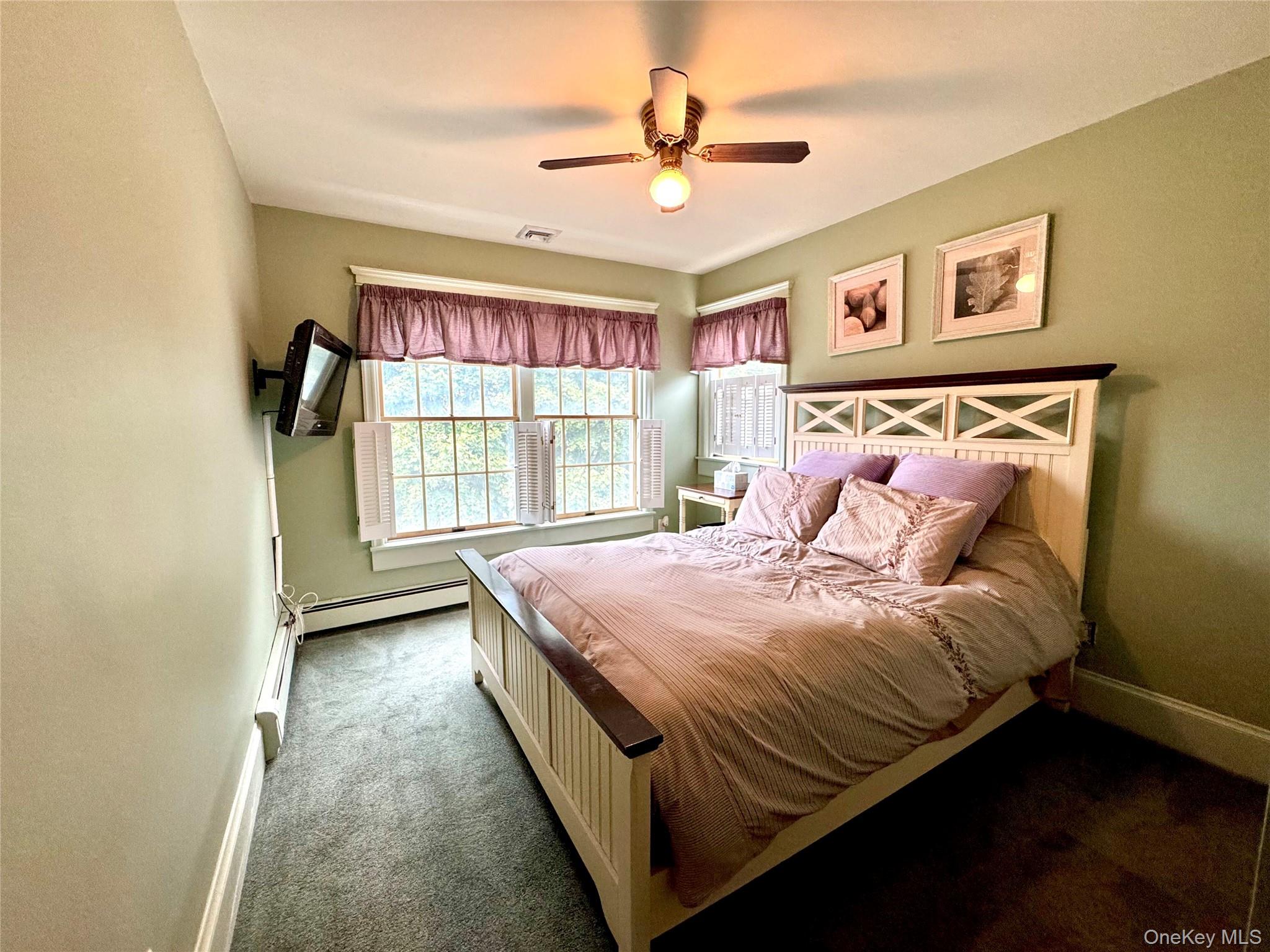 886 Sound Shore Road Riverhead, NY 11901 - Photo 28 of 39 2nd Bedroom with plenty of natural light and a ceiling fan