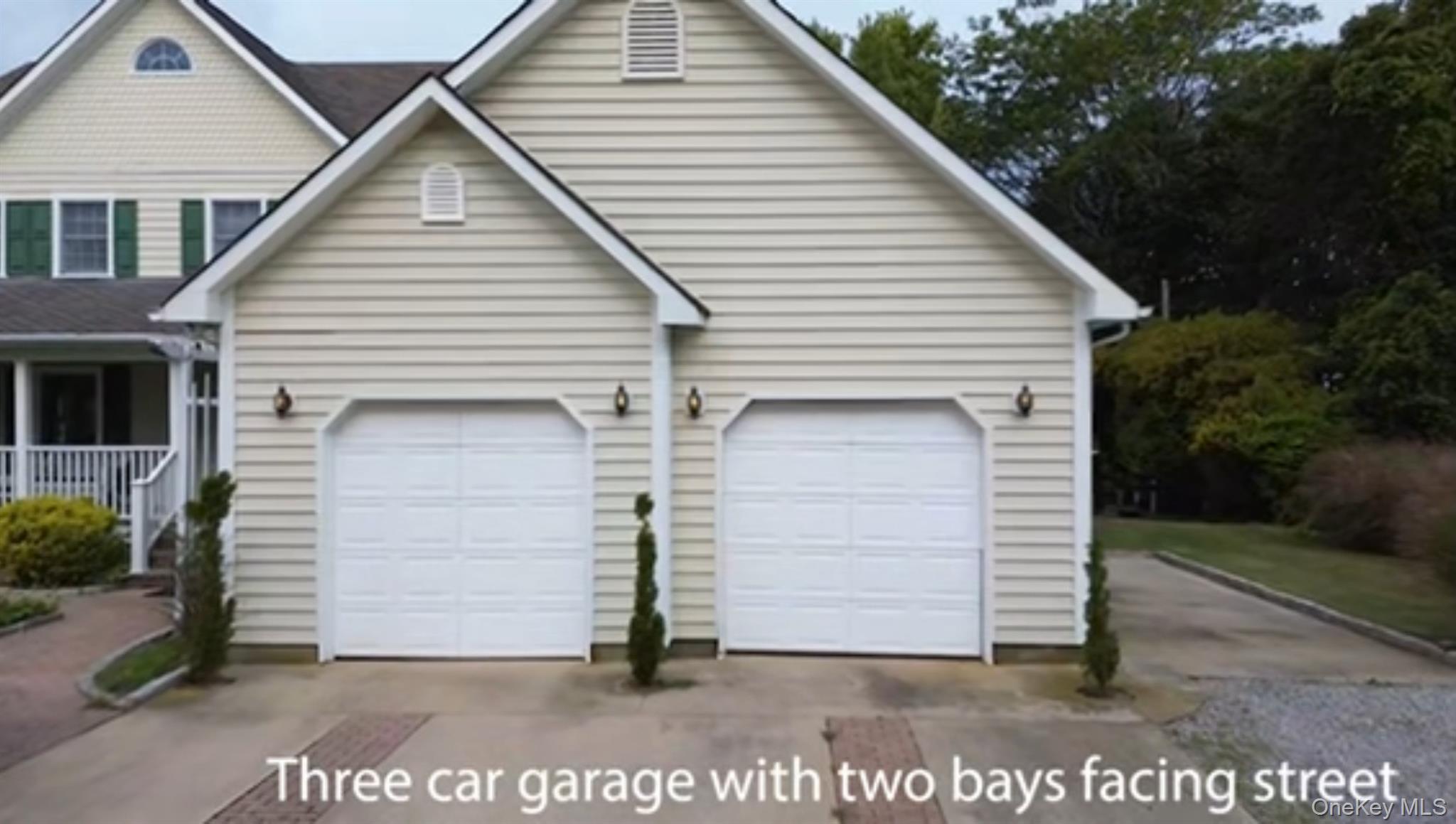 886 Sound Shore Road Riverhead, NY 11901 - Photo 3 of 39 2 garage bays facing the road