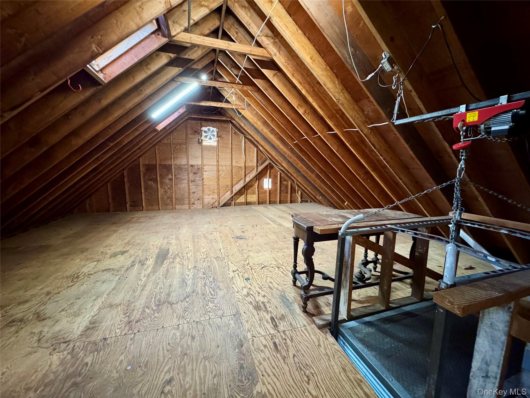 886 Sound Shore Road Riverhead, NY 11901 - Photo 35 of 39 Attic over garage with mechanical lift to deliver objects from the garage